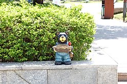 Hi-Line Gift Bear Holds Bird Bath with Cardinal, Brown