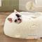 Show in main carousel: Bedsure Calming Fluffy Plush Faux Fur Orthopedic Anti-Slip Donut Dog & Cat Bed, Cream, Small slide 2 of 8