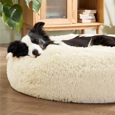 Show full view: Bedsure Calming Fluffy Plush Faux Fur Orthopedic Anti-Slip Donut Dog & Cat Bed, Cream, Large slide 4 of 8
