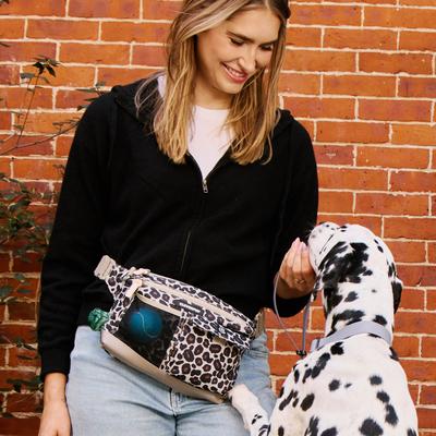 Show full view: Cleverpup Dog Walk & Train Sling Bag with Poop Bag Dispenser & Treat Pocket, Leopard slide 6 of 9