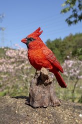 Hi-Line Gift 6.69-in Motion Activated Singing Cardinal Standing On Stump Outdoor Decor