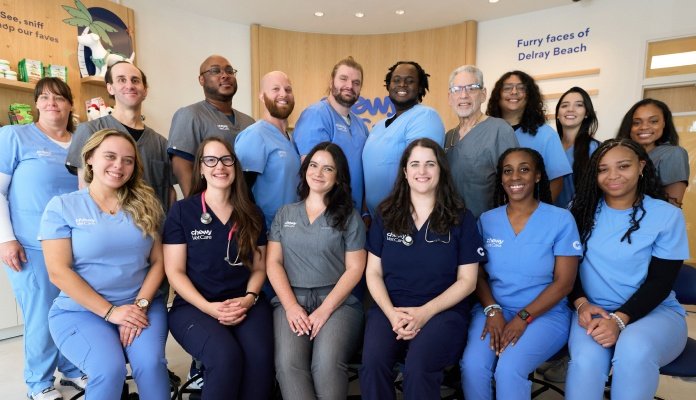 Members of the Chewy Vet Care Delray Beach care team gathered in the clinic