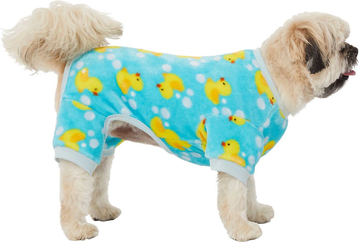 A small white dog wearing Rubber Ducky fleece PJs.