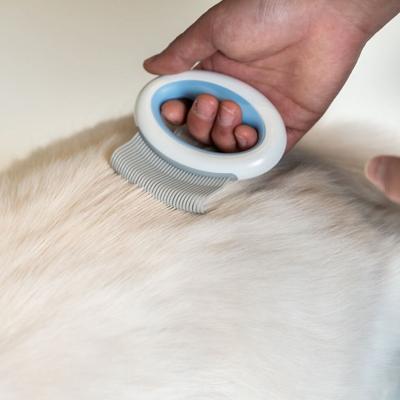 Show full view: Pet Life Knuckler Handheld Travel Flexible Grooming Dog & Cat Rake Comb, Pink slide 3 of 6